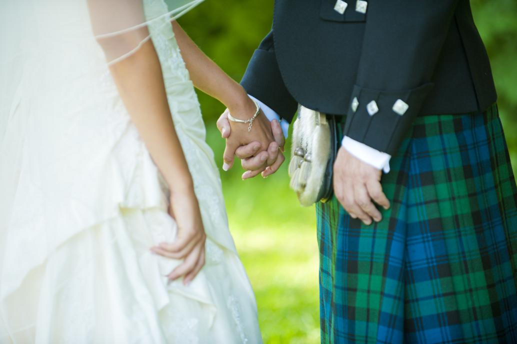 Bride and groom holding hand