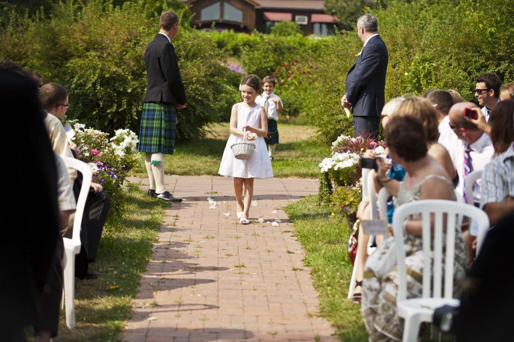 Flower girl walking down the aisle