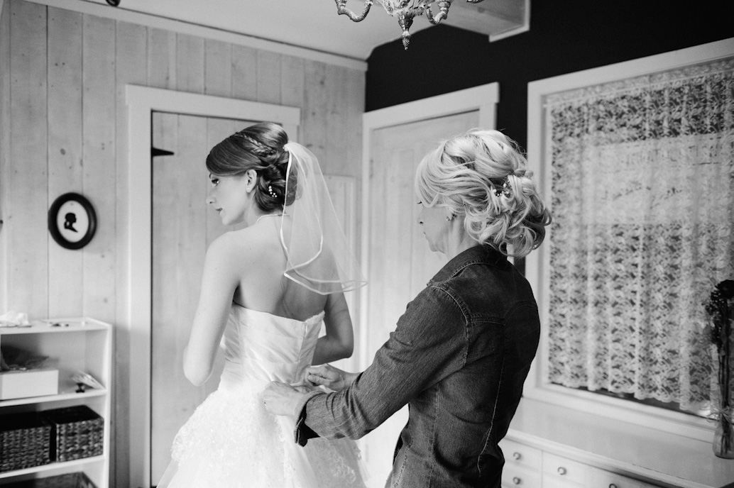 bride getting ready with mother